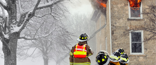 Graphic of firefighters fighting a fire in winter