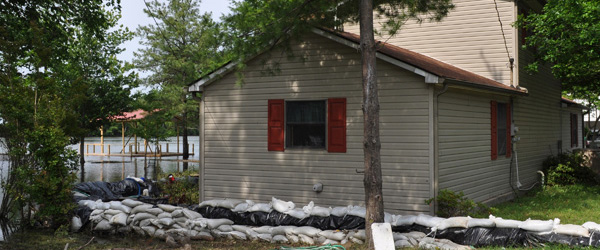Graphic of a home surrounded with sandbags