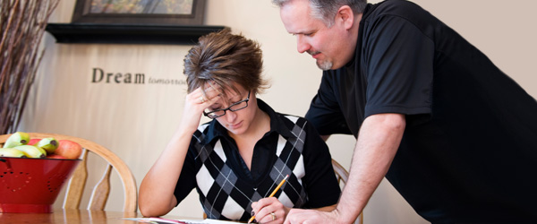 Graphic of a man and a woman reviewing a written document