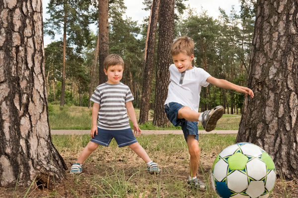 kids kicking a soccer ball