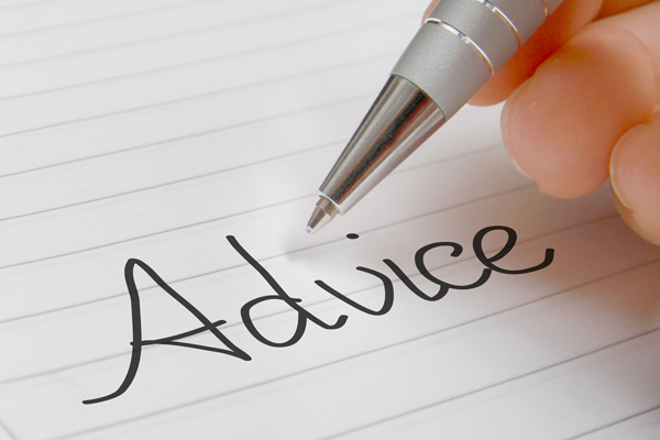 a person writing the word 'Advice'