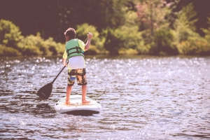 boy on a paddle boat