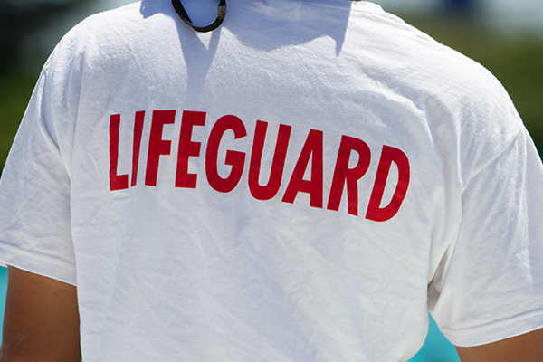 a person wearing a shirt that says 'Lifeguard'