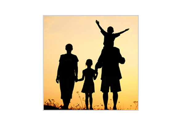silhouette of a family by a sunset